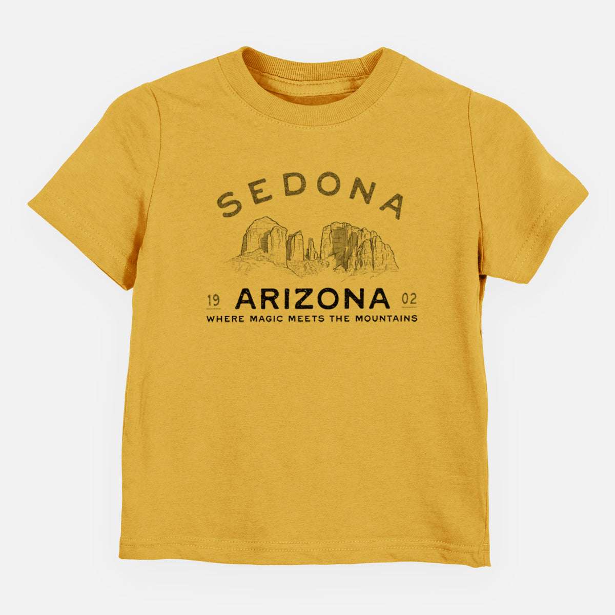 Honeycomb yellow toddler t-shirt laid flat, printed with black ink red rock buttes with the words Sedona Arizona, Where Magic Meets the Mountains.