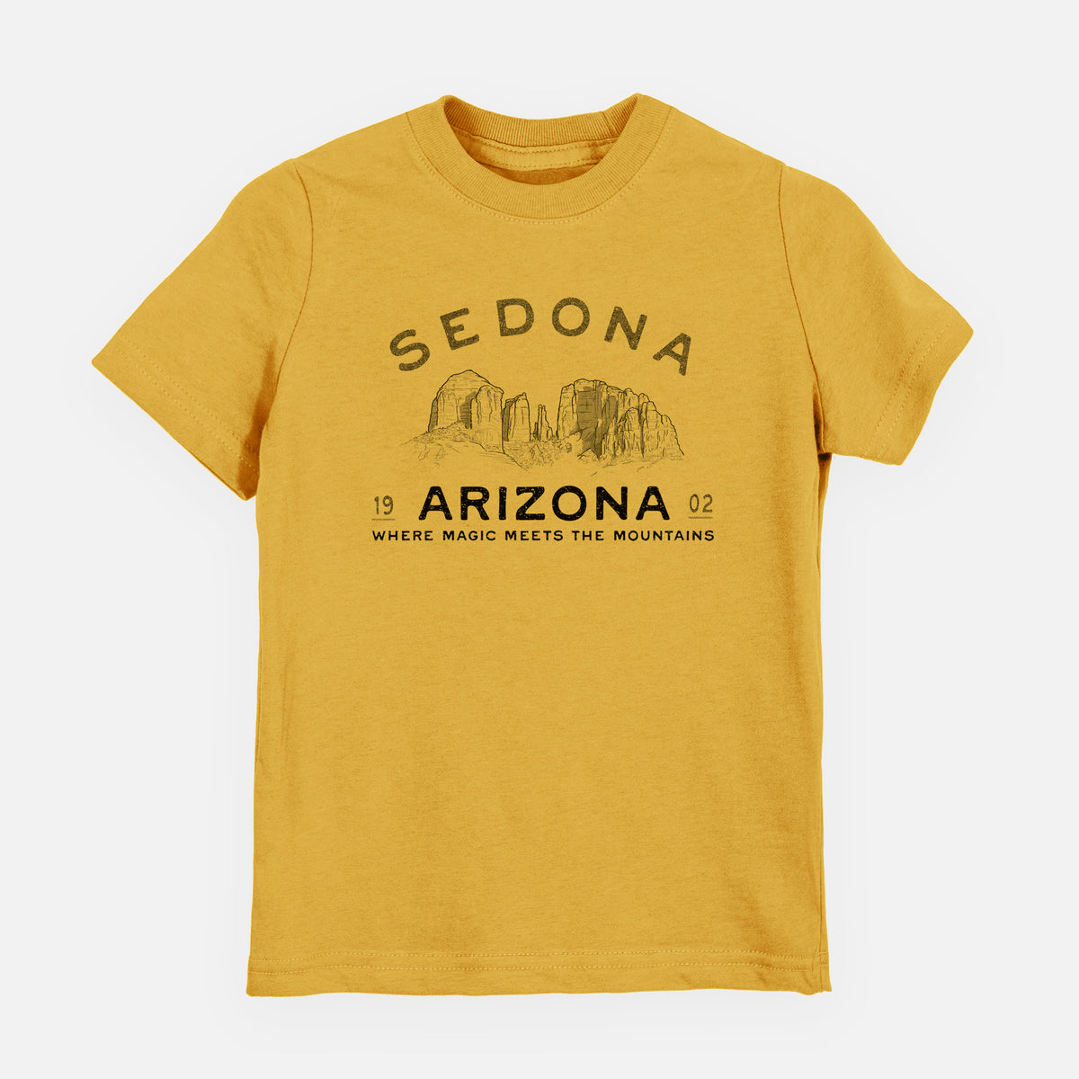 Honeycomb yellow youth t-shirt laid flat, printed with black ink red rock buttes with the words Sedona Arizona, Where Magic Meets the Mountains.