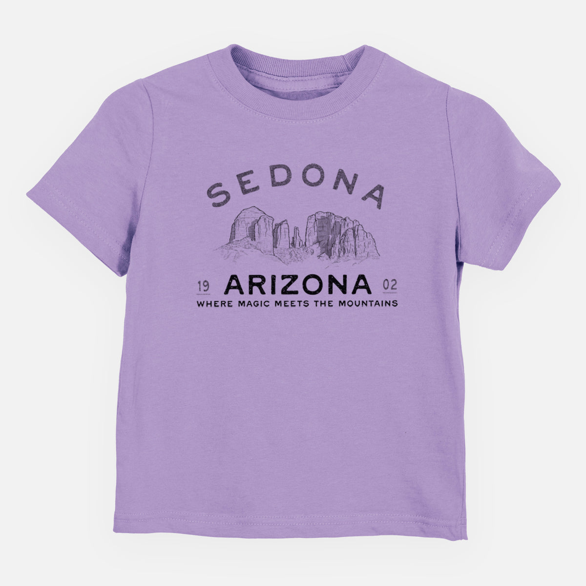 Lavender toddler t-shirt laid flat, printed with black ink red rock buttes with the words Sedona Arizona, Where Magic Meets the Mountains.