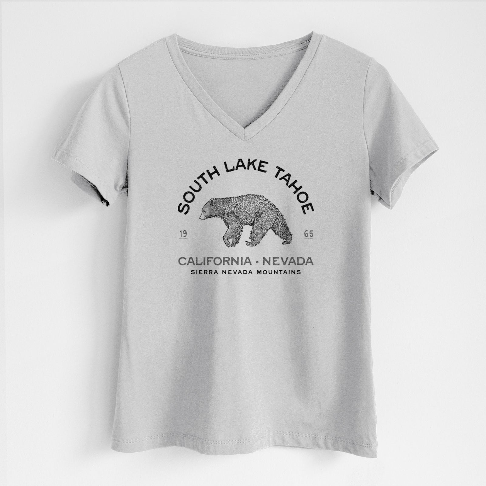 Lunar grey women's relaxed fit cotton V-neck t-shirt laid flat, printed with a black ink bear with the words South Lake Tahoe, California - Nevada, Sierra Nevada Mountains.