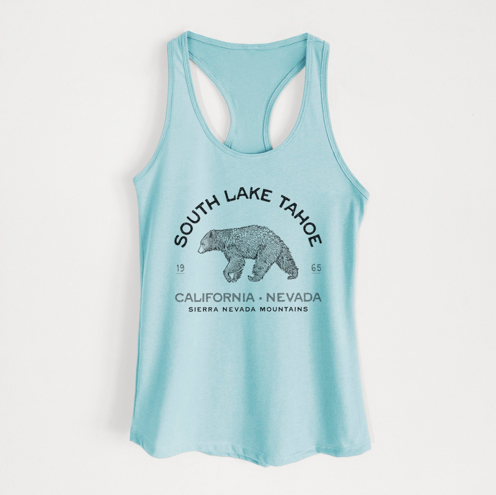 Banana cream women's racerback tank top laid flat, printed with a black ink bear with the words South Lake Tahoe, California - Nevada, Sierra Nevada Mountains.