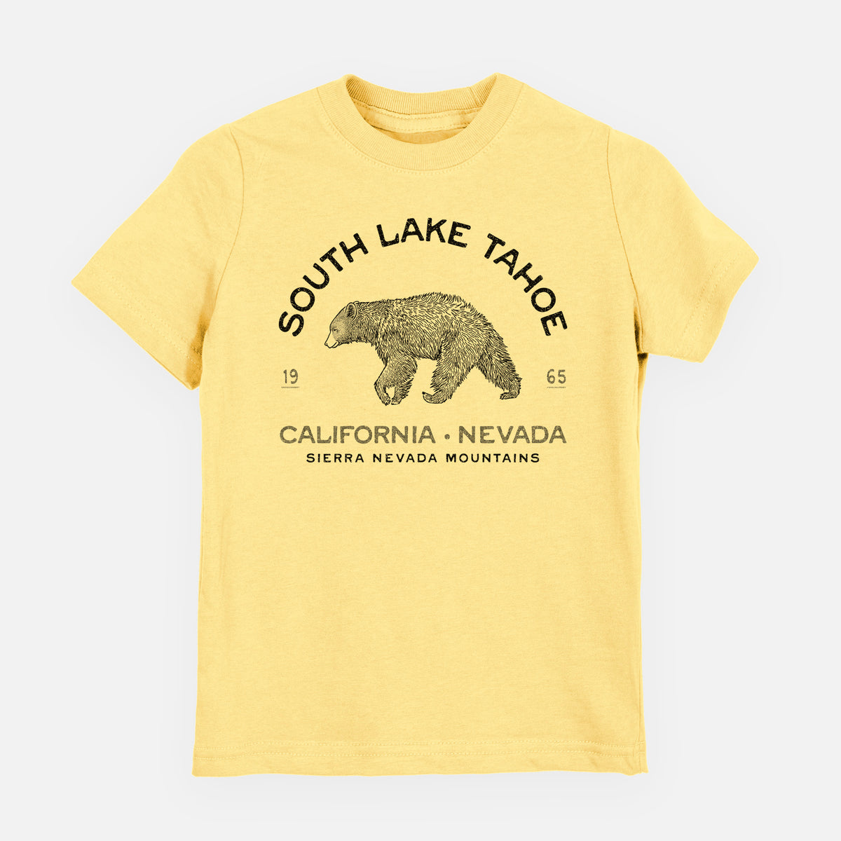 Butter yellow youth t-shirt laid flat, printed with a black ink bear with the words South Lake Tahoe, California - Nevada, Sierra Nevada Mountains.