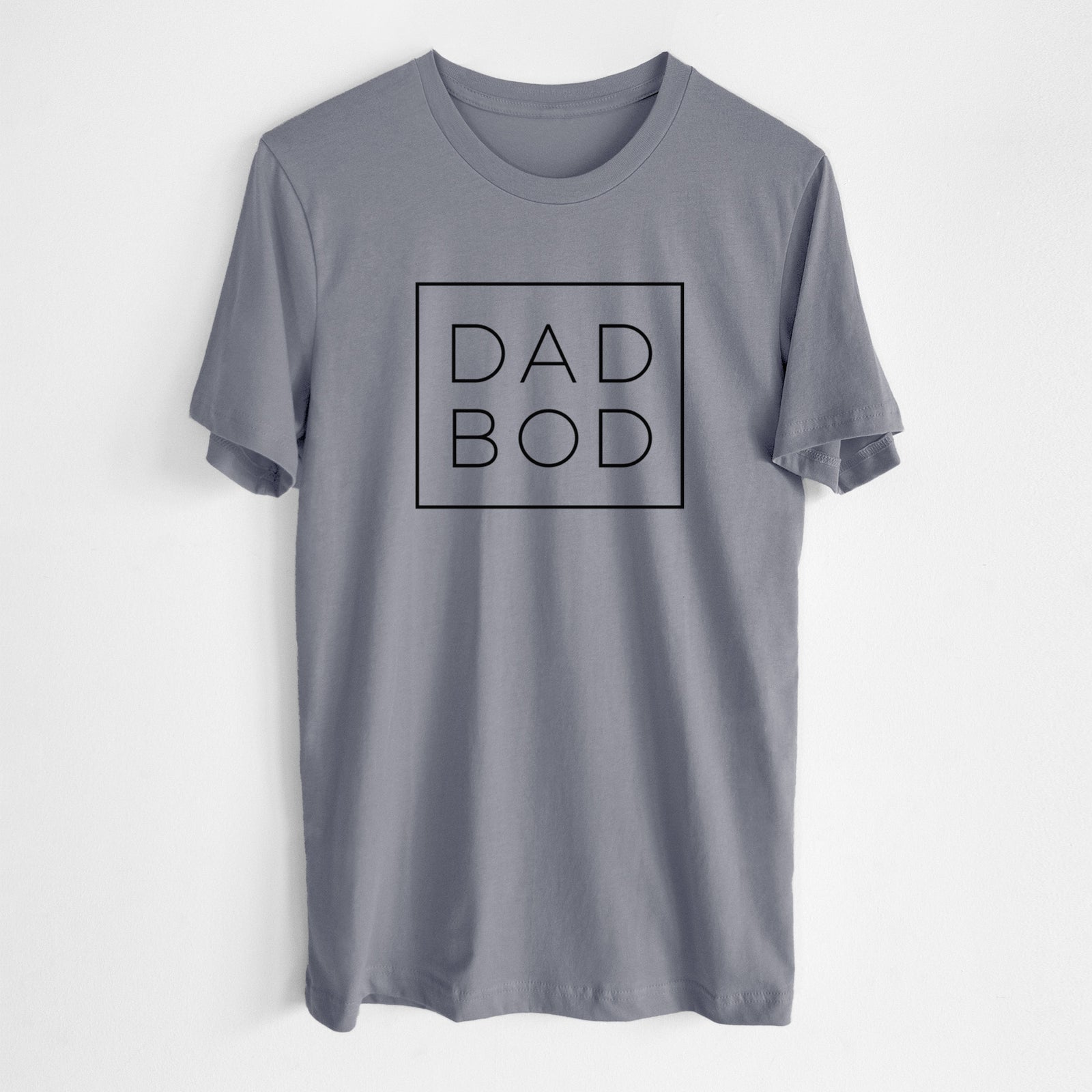 Storm grey lightweight cotton t-shirt laid flat, printed with the words DAD BOD in thin black letters stacked inside a square outline.