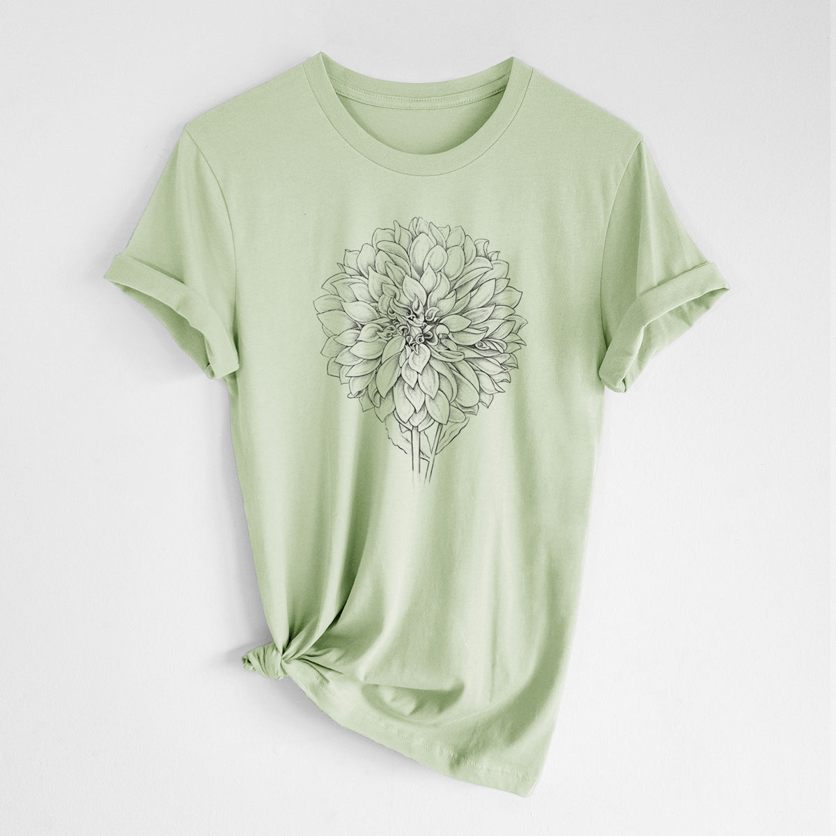 Spring green lightweight cotton t-shirt laid flat with the sleeves rolled, printed with a detailed black ink line drawing of a Cafe au Lait dahlia bloom.