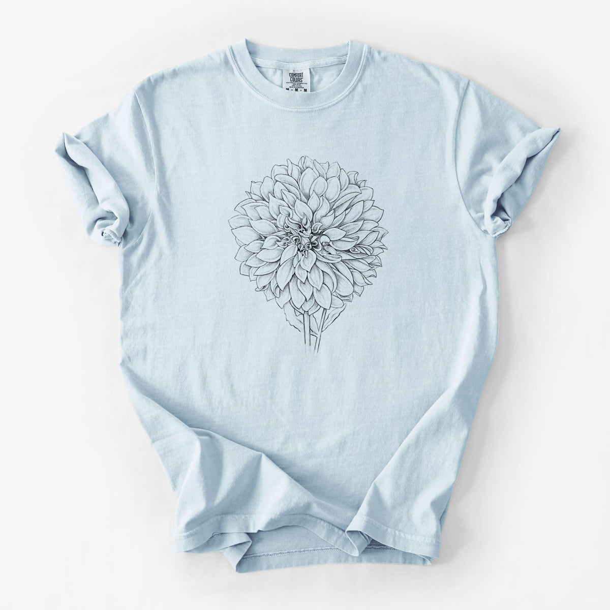 Chambray blue Comfort Colors t-shirt laid flat, printed with a detailed black ink line drawing of a Cafe au Lait dahlia bloom.