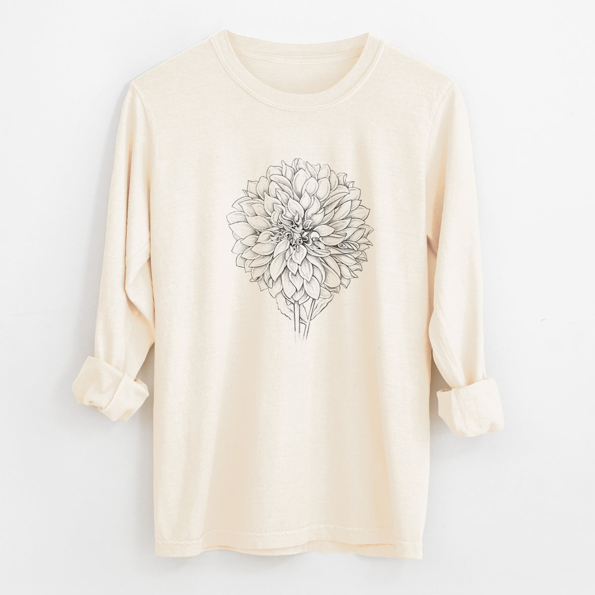 Ivory Comfort Colors long sleeve shirt laid flat with the cuffs rolled, printed with a detailed black ink line drawing of a Cafe au Lait dahlia bloom.