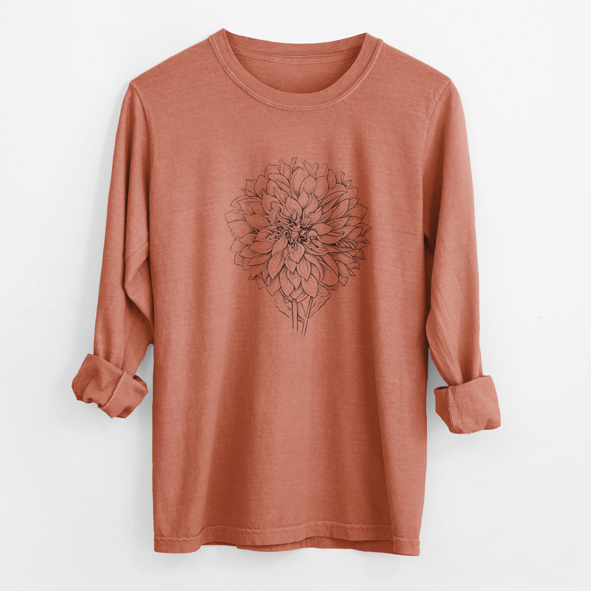 Yam burnt orange Comfort Colors long sleeve shirt laid flat with the cuffs rolled, printed with a detailed black ink line drawing of a Cafe au Lait dahlia bloom.