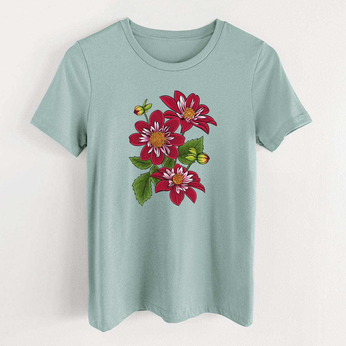 Dusty blue women's relaxed fit cotton t-shirt laid flat, printed with a full-color illustration of deep red dahlia flowers with green leaves and a small bee.