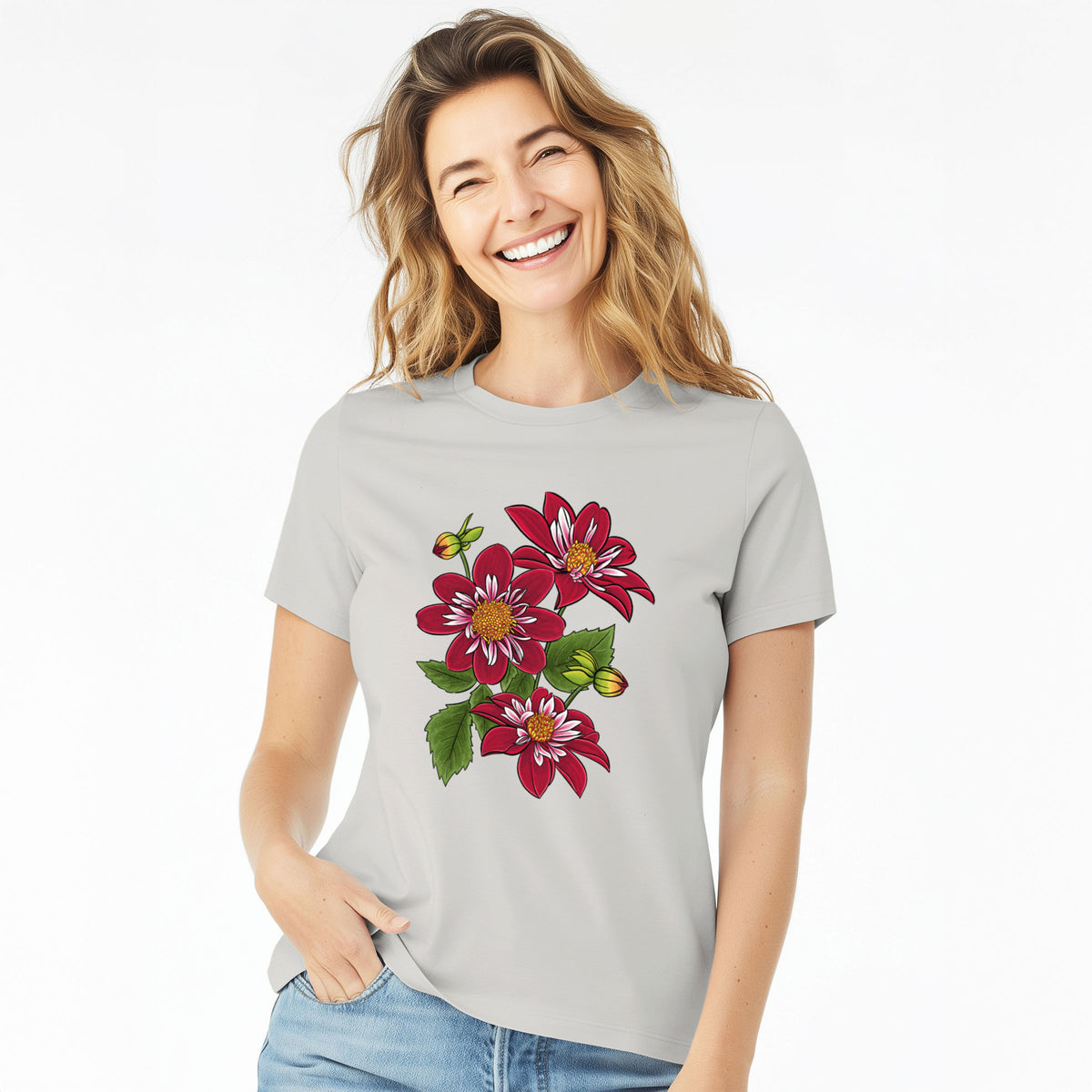 Woman wearing a lunar grey women's relaxed fit cotton t-shirt printed with a full-color illustration of deep red dahlia flowers with green leaves and a small bee.