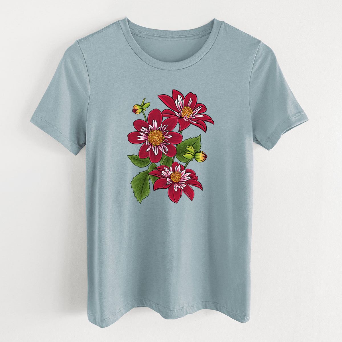 Vintage denim women's relaxed fit cotton t-shirt laid flat, printed with a full-color illustration of deep red dahlia flowers with green leaves and a small bee.