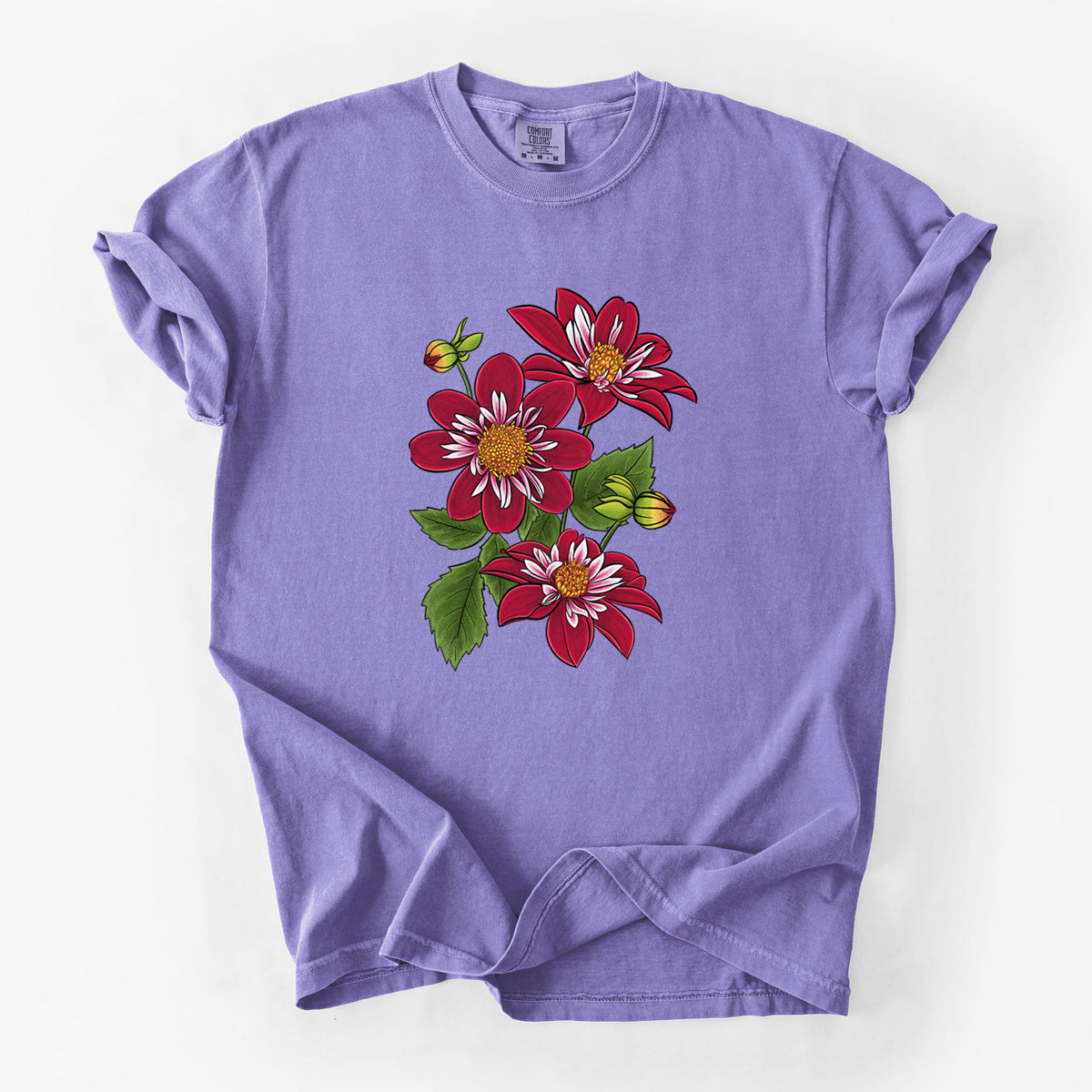 Violet purple Comfort Colors t-shirt laid flat, printed with a full-color illustration of deep red dahlia flowers with green leaves and a small bee.