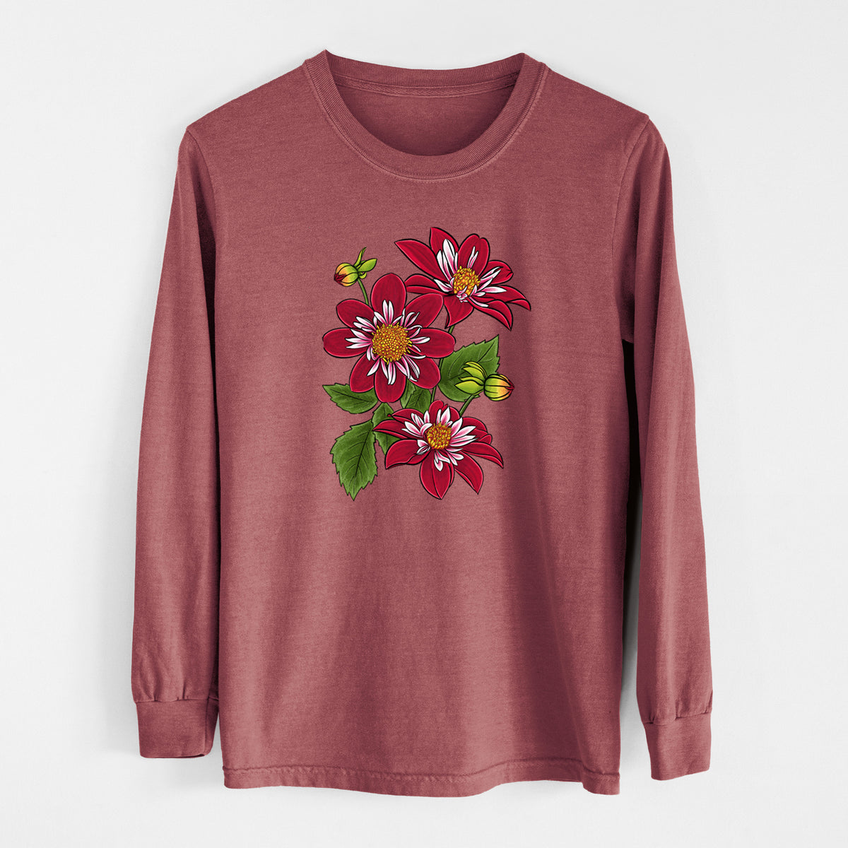 Brick red Comfort Colors long sleeve shirt laid flat, printed with a full-color illustration of deep red dahlia flowers with green leaves and a small bee.