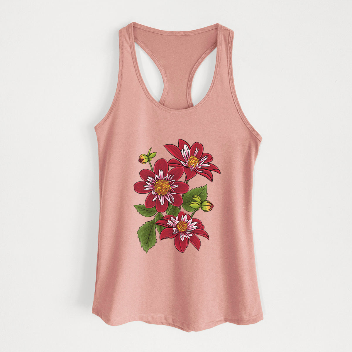 Desert pink women's racerback tank top laid flat, printed with a full-color illustration of deep red dahlia flowers with green leaves and a small bee.