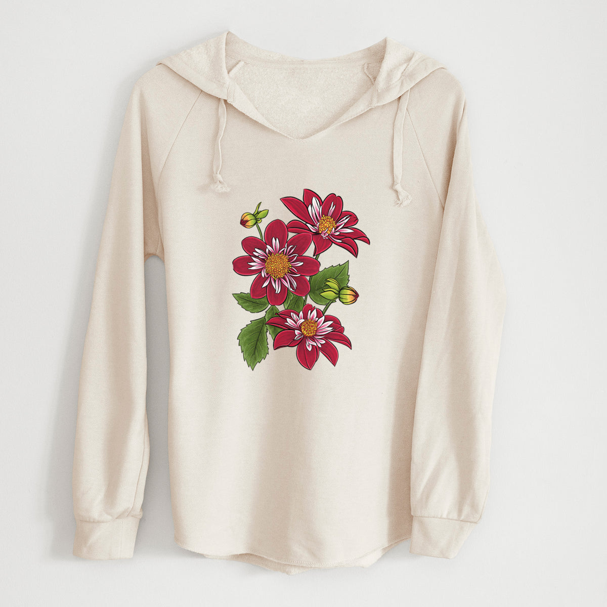 Bone cream women's Cali Wave hooded sweatshirt laid flat, printed with a full-color illustration of deep red dahlia flowers with green leaves and a small bee.