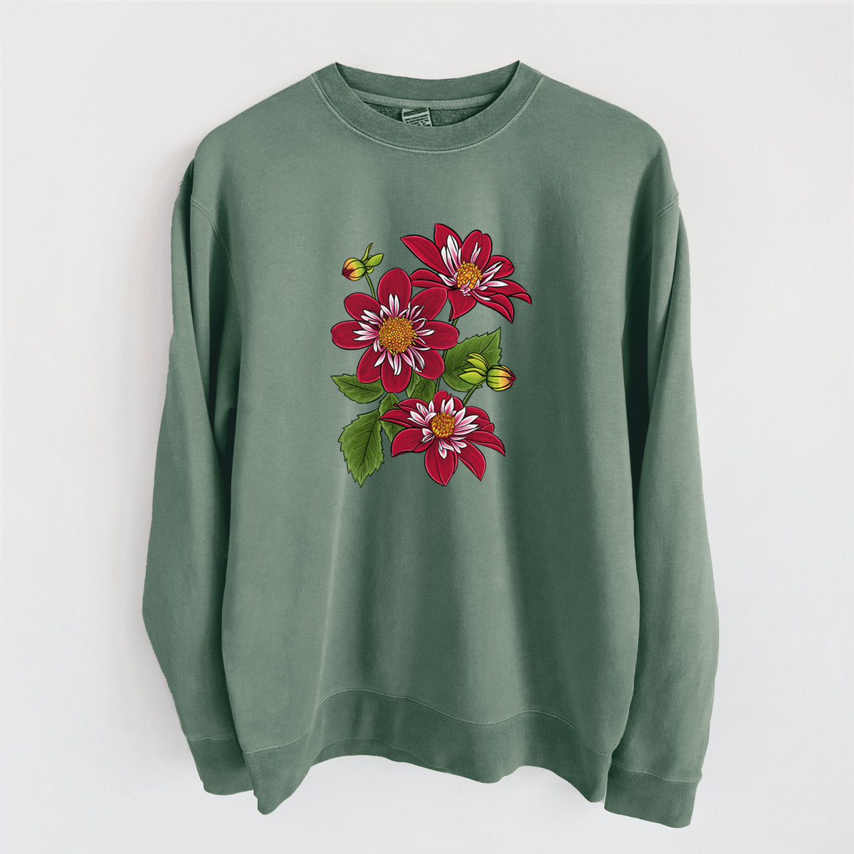 Alpine green pigment dyed crewneck sweatshirt laid flat, printed with a full-color illustration of deep red dahlia flowers with green leaves and a small bee.