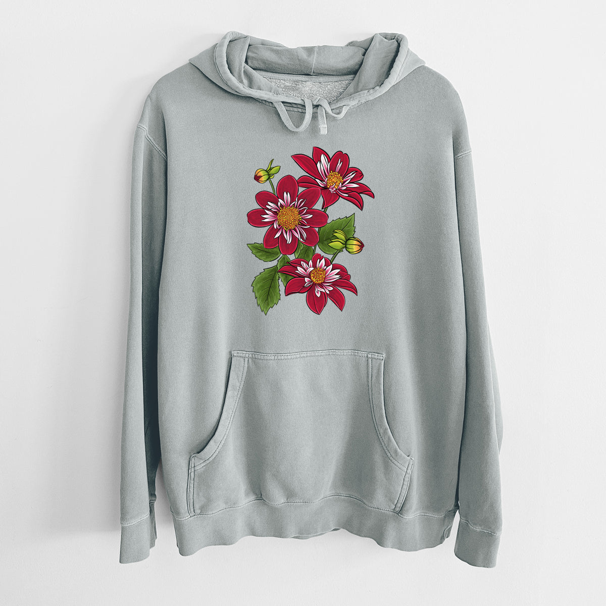 Sage green pigment dyed hoodie laid flat, printed with a full-color illustration of deep red dahlia flowers with green leaves and a small bee.