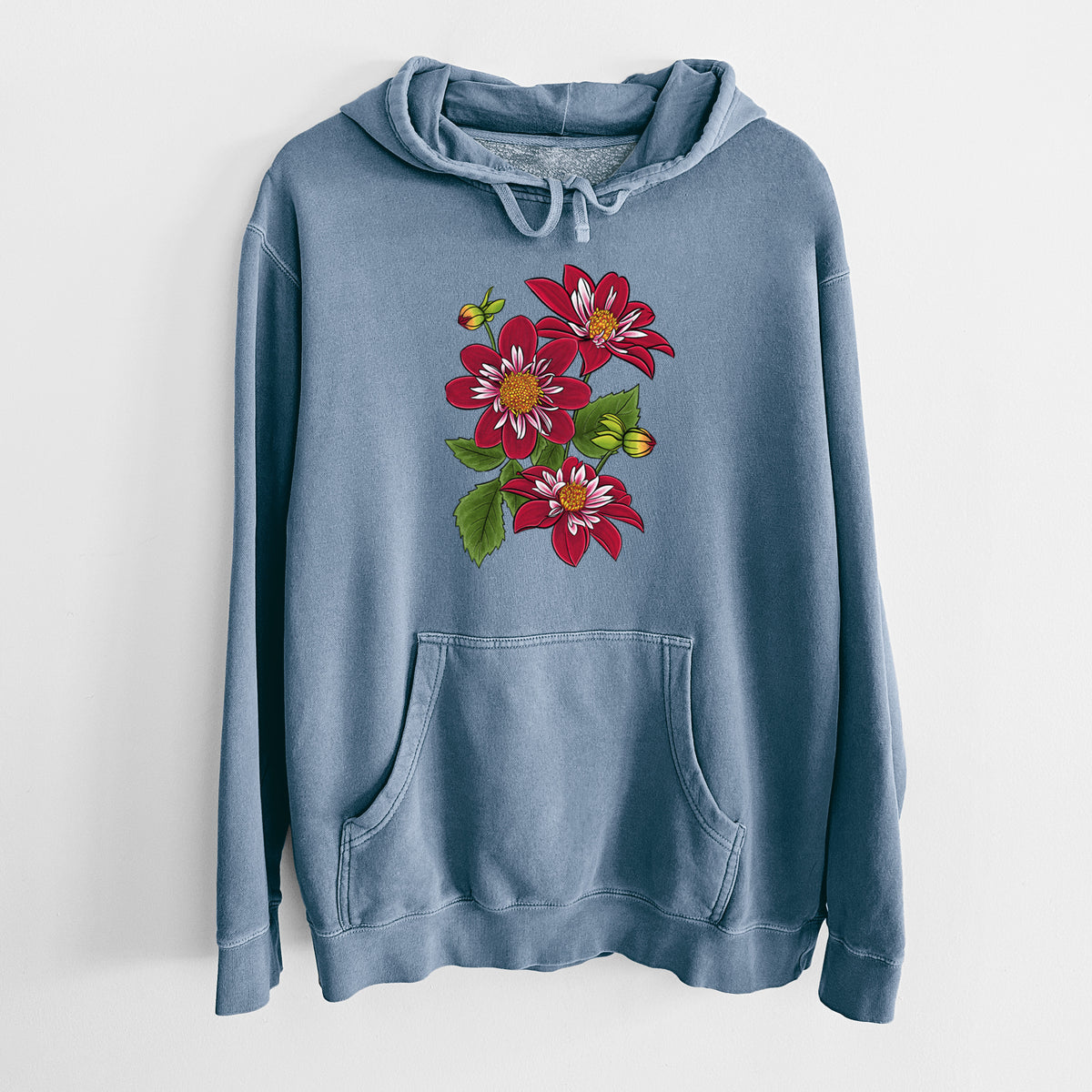 Slate blue pigment dyed hoodie laid flat, printed with a full-color illustration of deep red dahlia flowers with green leaves and a small bee.