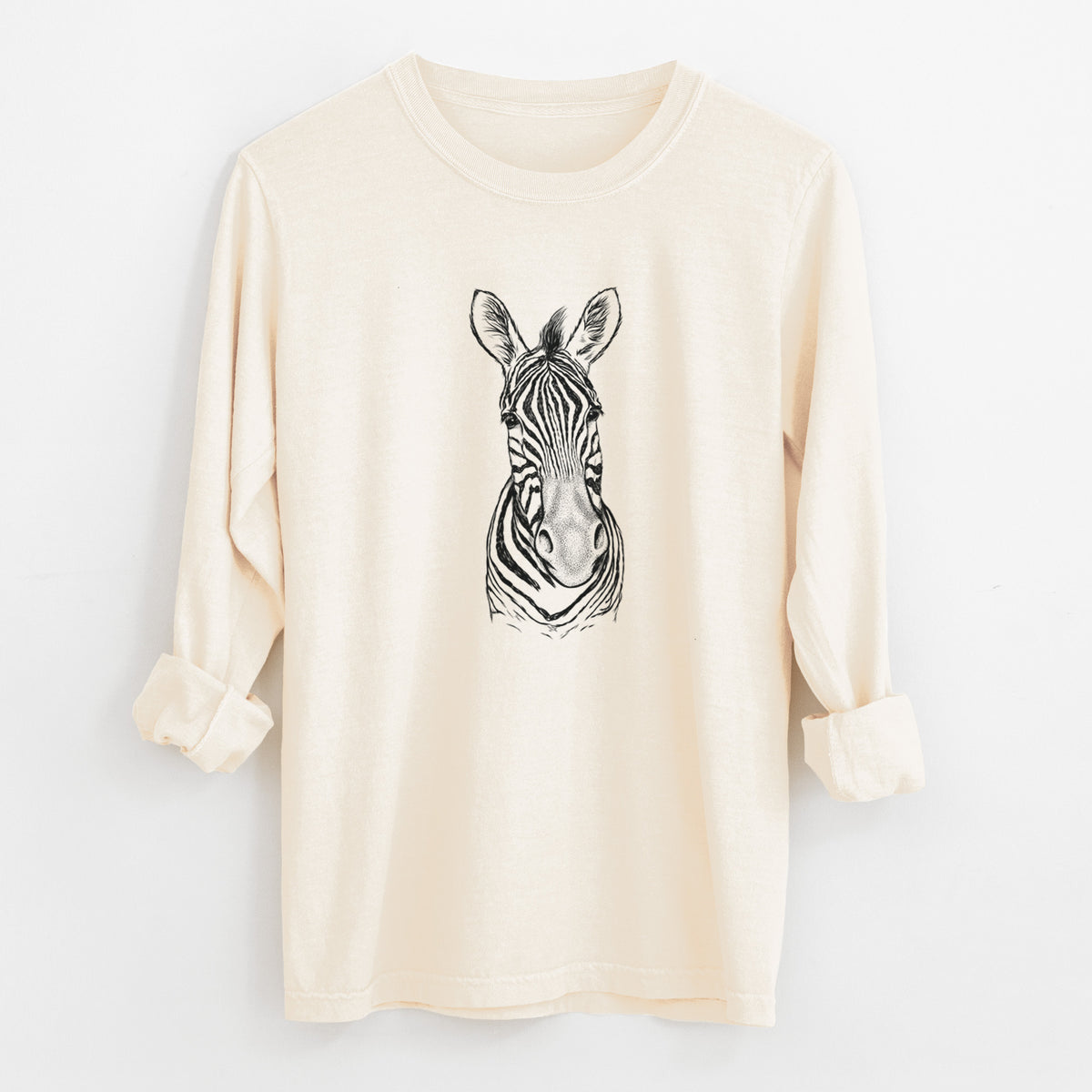 Ivory Comfort Colors long sleeve shirt laid flat with the cuffs rolled, printed with a detailed black ink portrait of a Damara zebra facing forward.