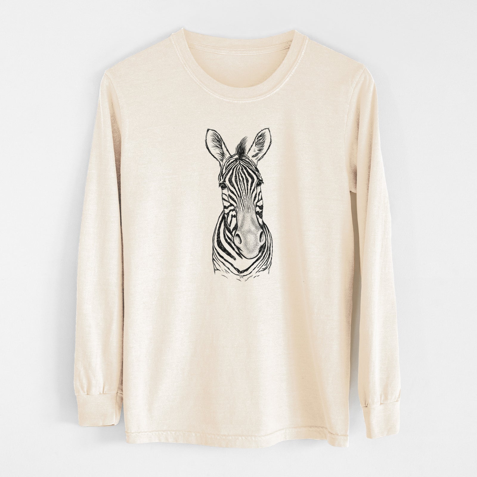 Ivory Comfort Colors long sleeve shirt laid flat, printed with a detailed black ink portrait of a Damara zebra facing forward.