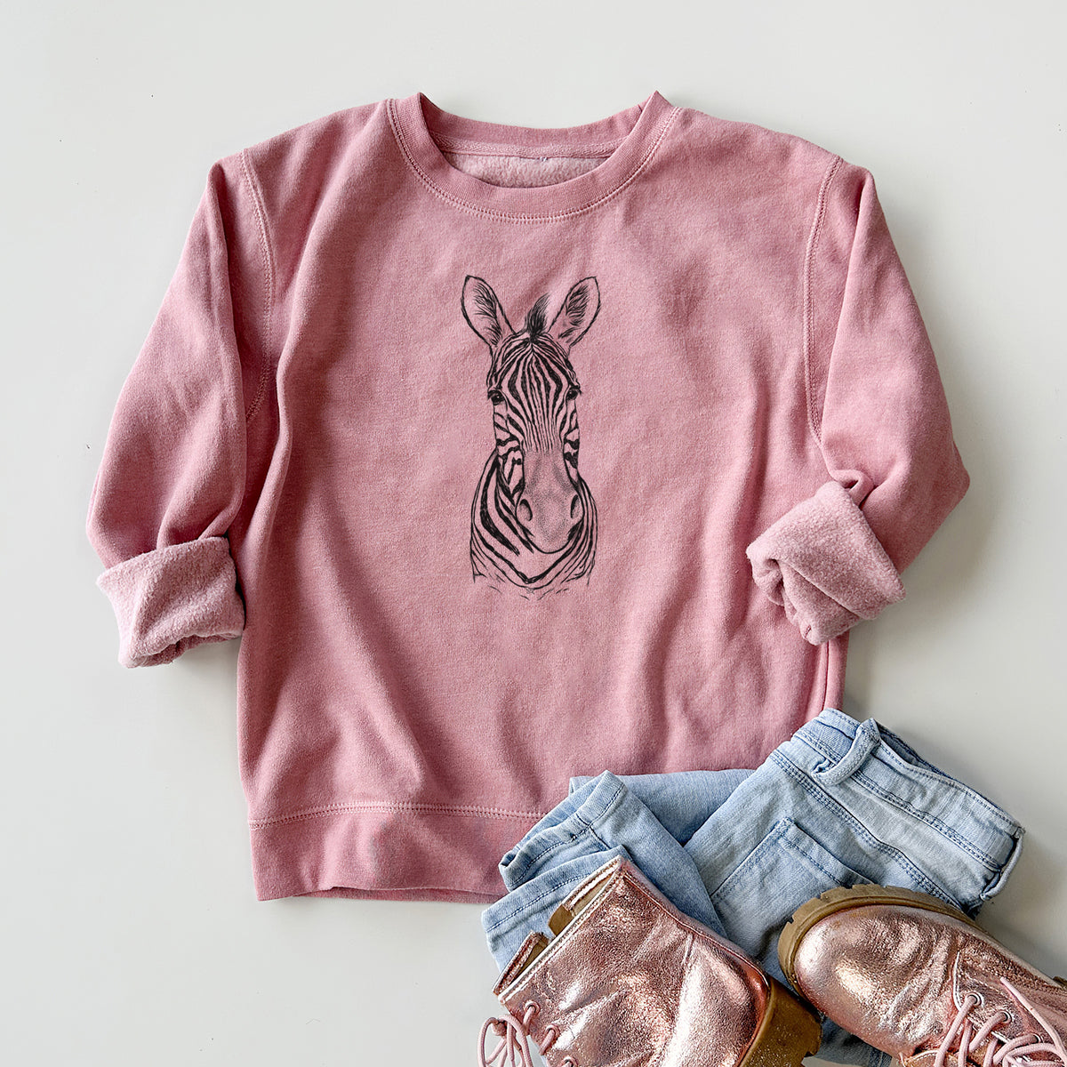 Youth crewneck sweatshirt printed with a detailed black ink portrait of a Damara zebra facing forward, styled flat with jeans and boots.