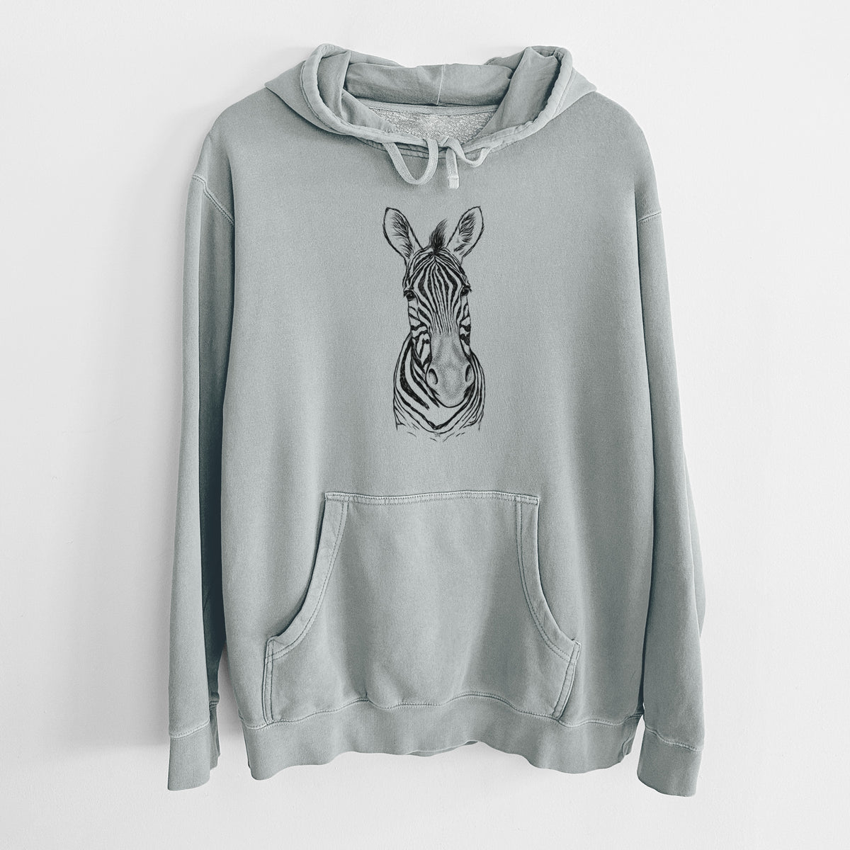 Sage green pigment dyed hoodie laid flat, printed with a detailed black ink portrait of a Damara zebra facing forward.