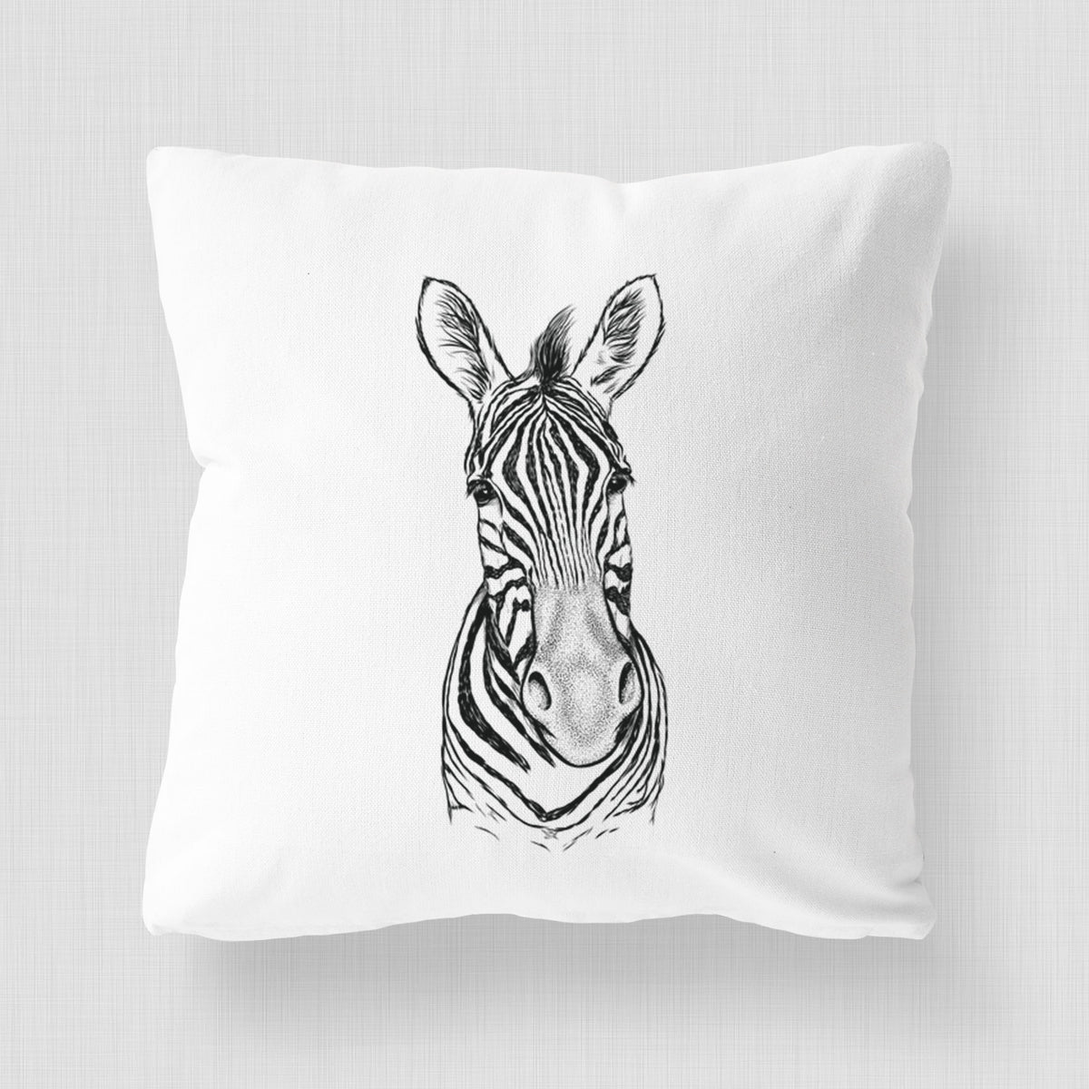 White pillow cover printed with a detailed black ink portrait of a Damara zebra facing forward.