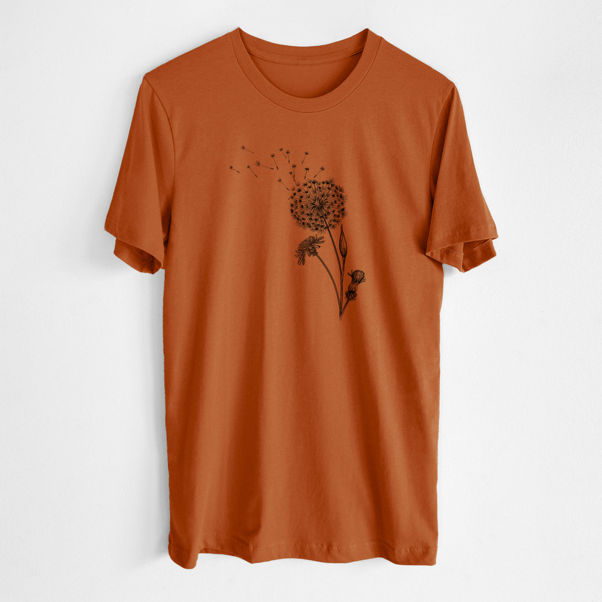 Autumn lightweight cotton t-shirt laid flat, printed with a black ink line drawing of a dandelion seed head with seeds blowing away.