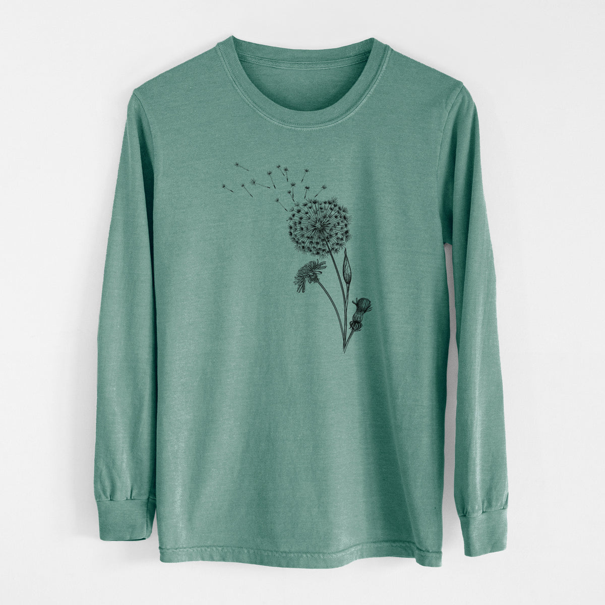 Pine green Comfort Colors long sleeve shirt laid flat, printed with a black ink line drawing of a dandelion seed head with seeds blowing away.