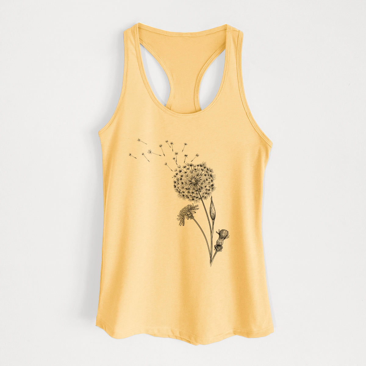 Banana cream women's racerback tank top laid flat, printed with a black ink line drawing of a dandelion seed head with seeds blowing away.