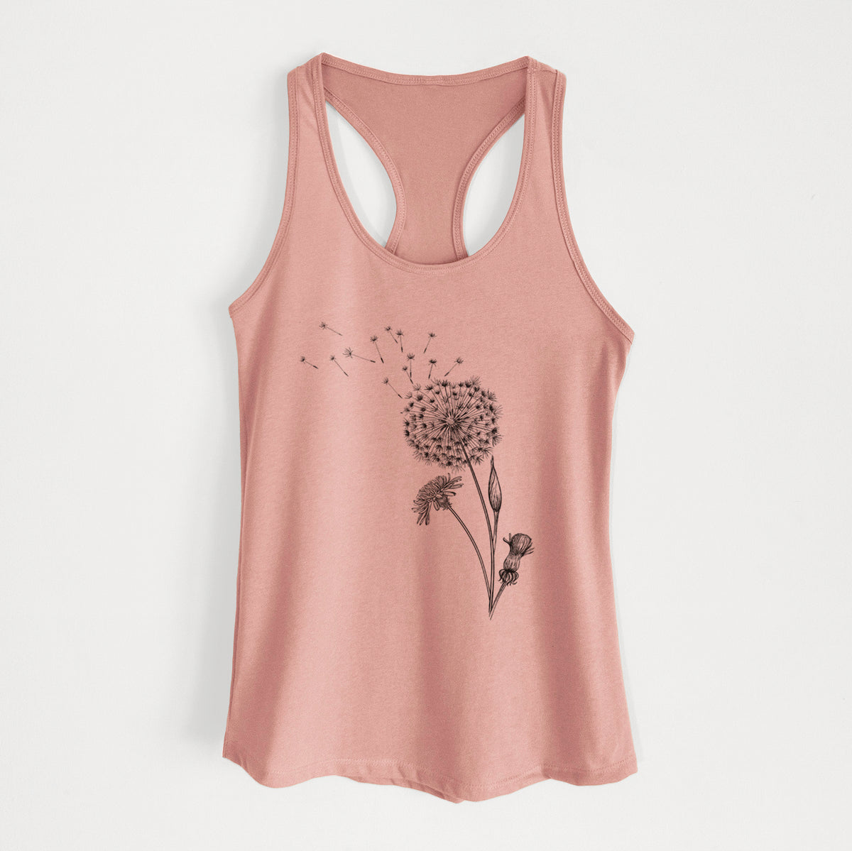 Desert pink women's racerback tank top laid flat, printed with a black ink line drawing of a dandelion seed head with seeds blowing away.
