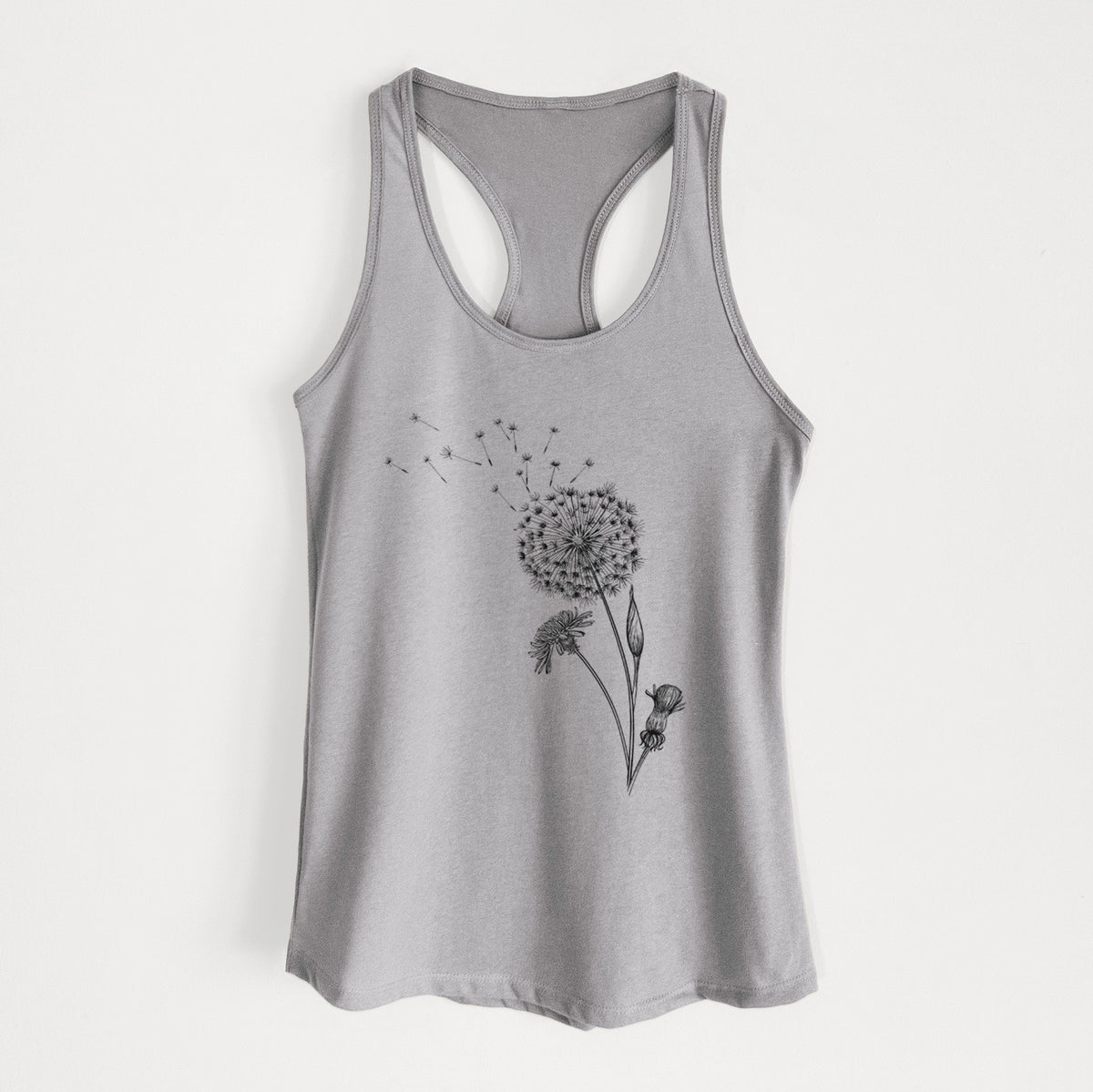 Heather grey women's racerback tank top laid flat, printed with a black ink line drawing of a dandelion seed head with seeds blowing away.