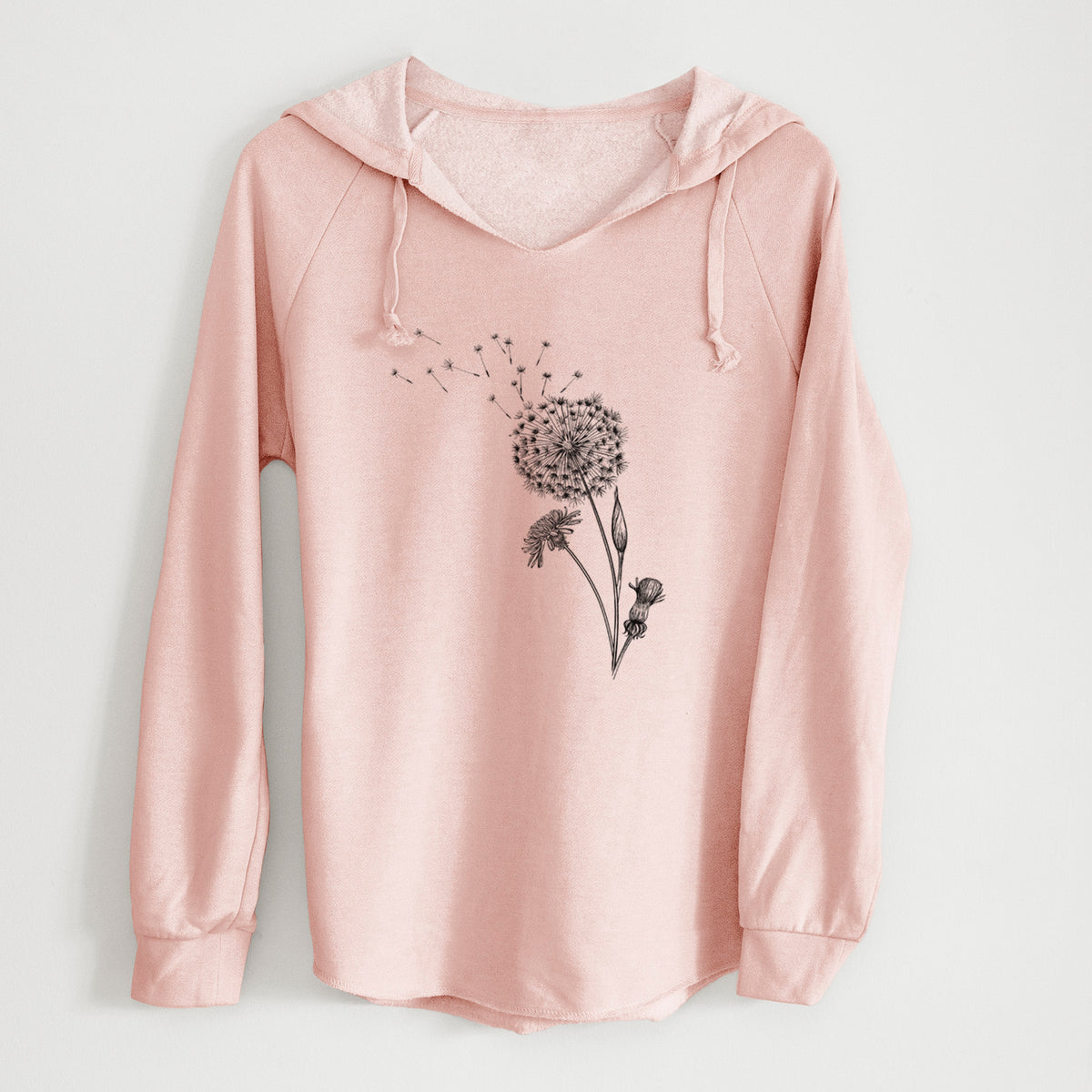 Blush pink women's Cali Wave hooded sweatshirt laid flat, printed with a black ink line drawing of a dandelion seed head with seeds blowing away.