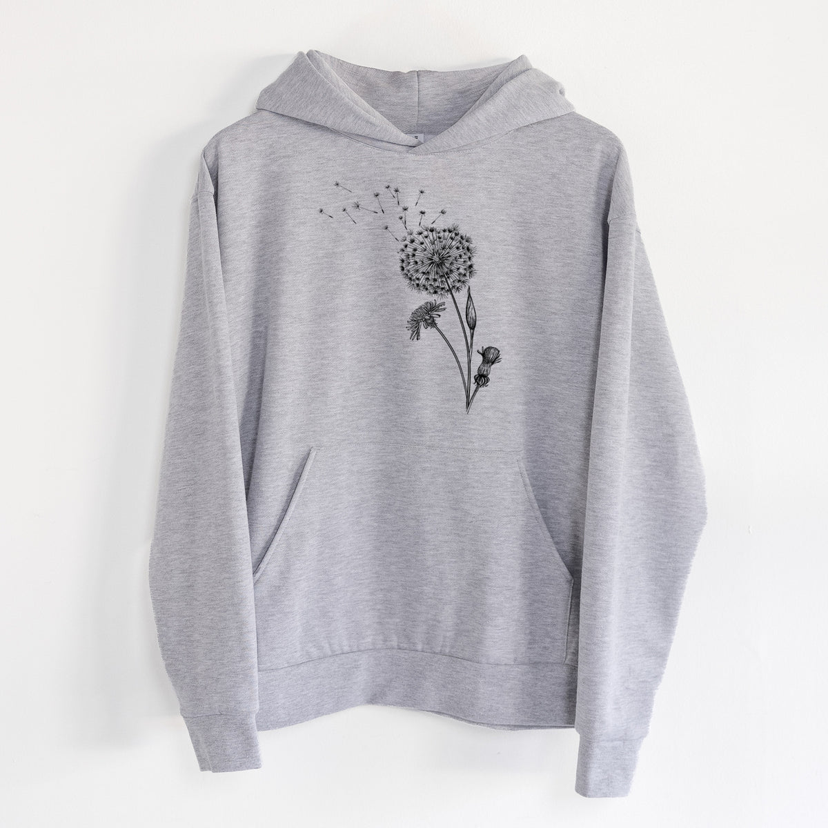 Common Dandelion - Taraxacum officinale - Statement Midweight Hoodie in Heather Grey, hanging on a white wall, with a front kangaroo pocket and no drawcords.