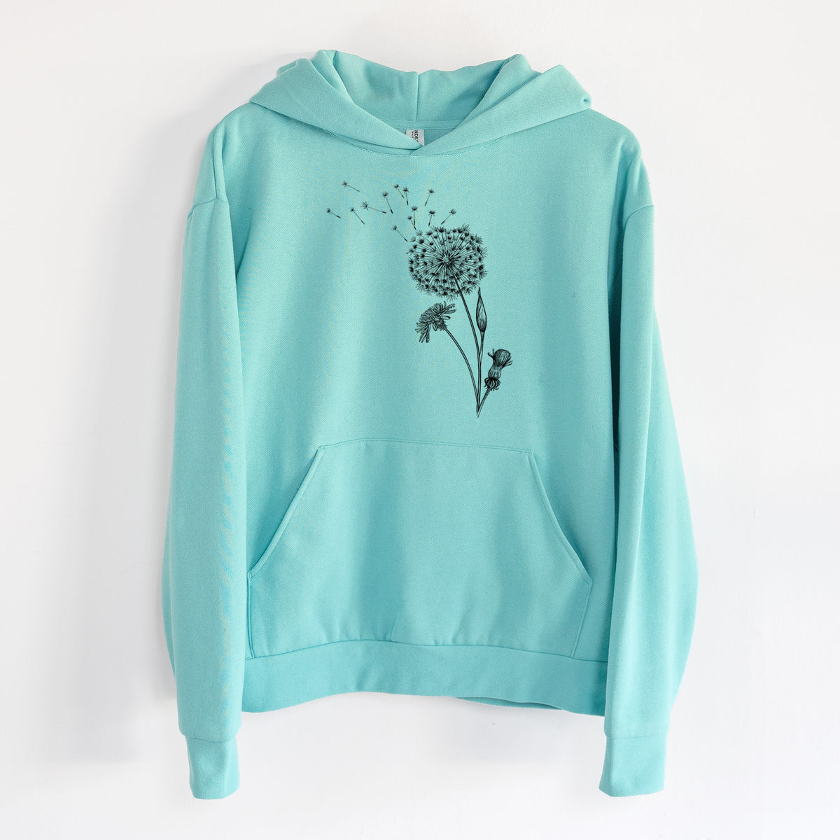 Common Dandelion - Taraxacum officinale - Statement Midweight Hoodie in Seafoam, hanging on a white wall, with a front kangaroo pocket and no drawcords.