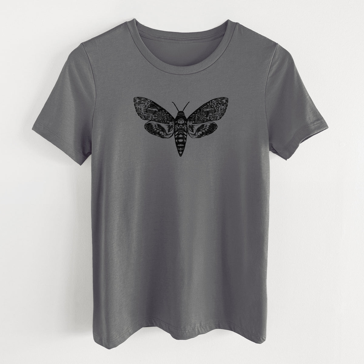 Asphalt women's relaxed fit cotton t-shirt laid flat, printed with a detailed black ink illustration of a death's-head hawkmoth with its wings spread.