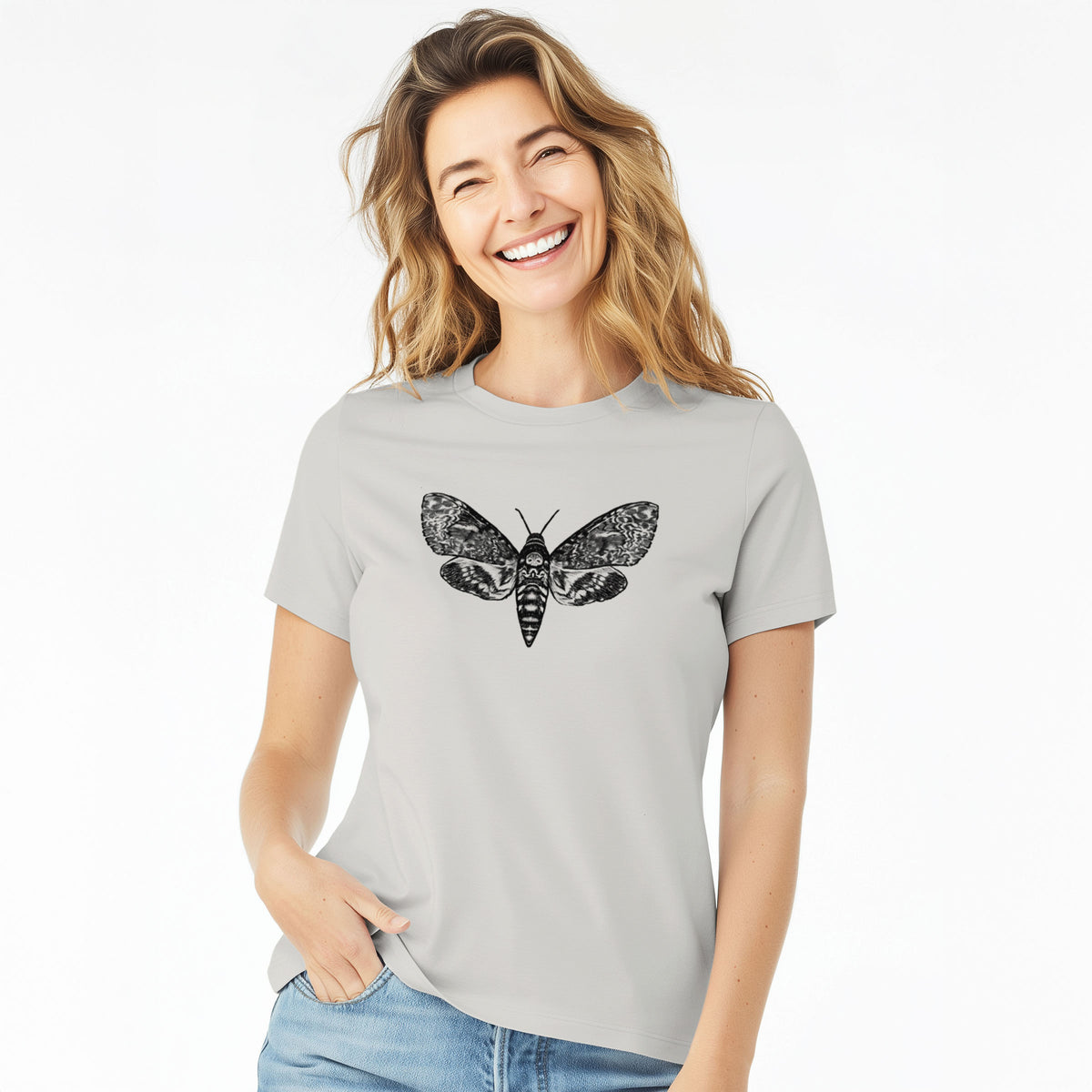 Woman wearing a lunar grey women's relaxed fit cotton t-shirt printed with a detailed black ink illustration of a death's-head hawkmoth with its wings spread.