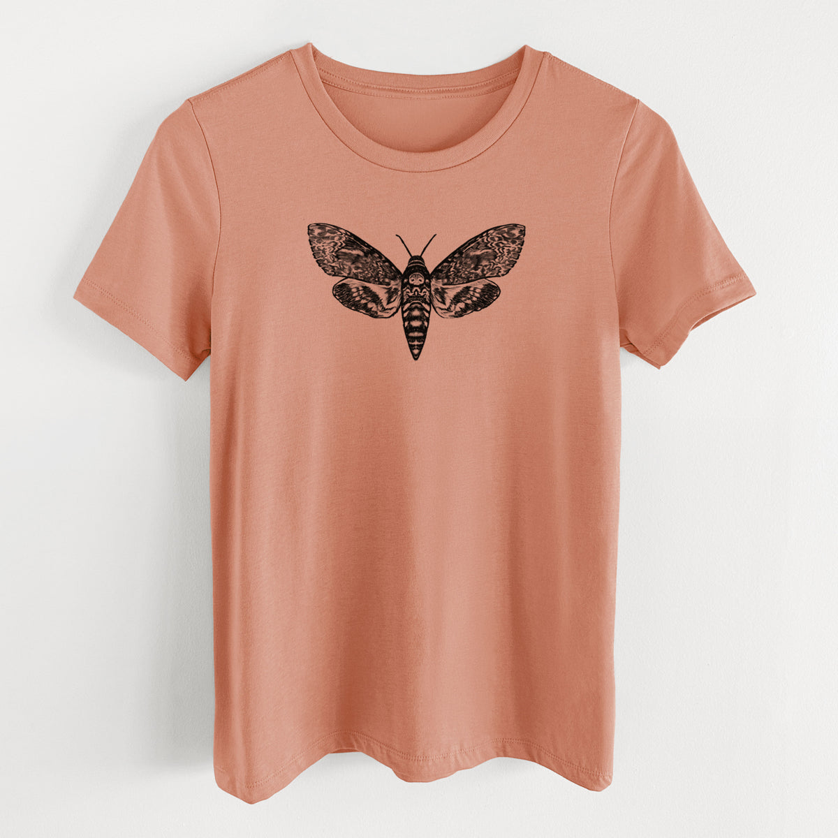 Terracotta orange women's relaxed fit cotton t-shirt laid flat, printed with a detailed black ink illustration of a death's-head hawkmoth with its wings spread.
