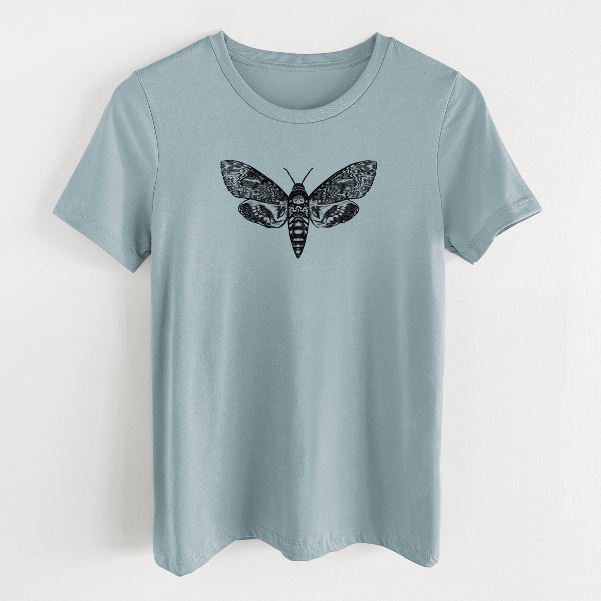 Vintage denim women's relaxed fit cotton t-shirt laid flat, printed with a detailed black ink illustration of a death's-head hawkmoth with its wings spread.