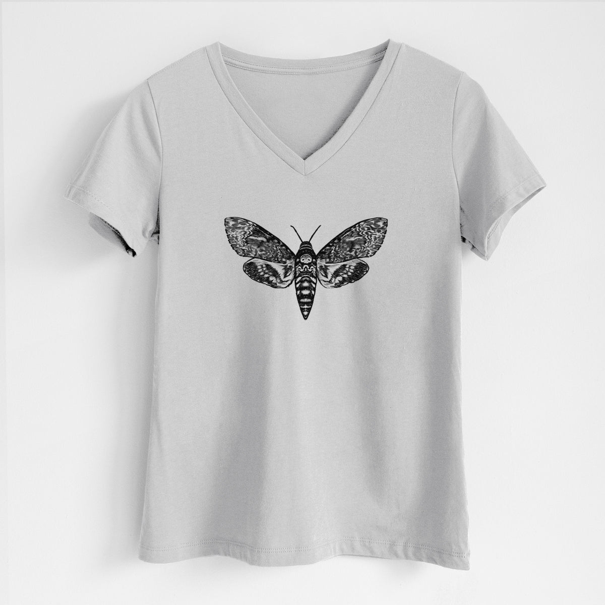 Lunar grey women's relaxed fit cotton V-neck t-shirt laid flat, printed with a detailed black ink illustration of a death's-head hawkmoth with its wings spread.