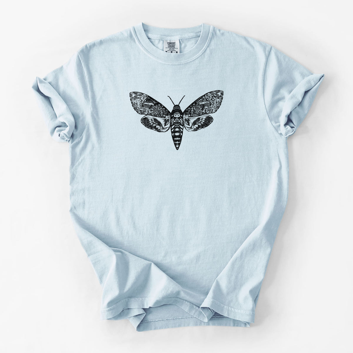 Chambray blue Comfort Colors t-shirt laid flat, printed with a detailed black ink illustration of a death's-head hawkmoth with its wings spread.