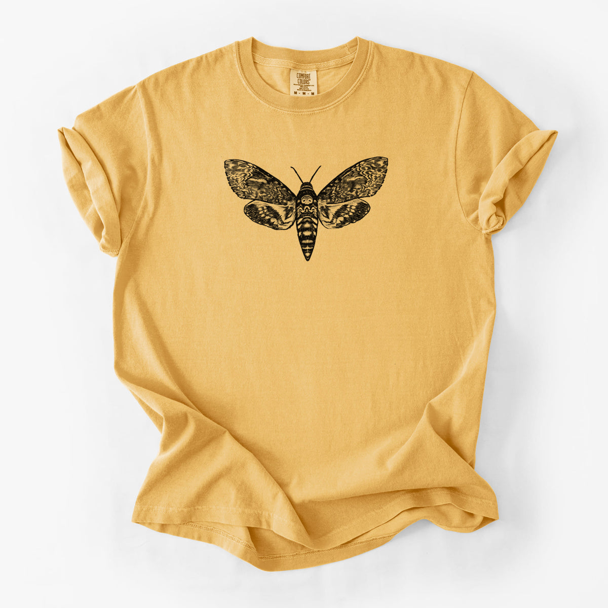 Golden wheat yellow Comfort Colors t-shirt laid flat, printed with a detailed black ink illustration of a death's-head hawkmoth with its wings spread.