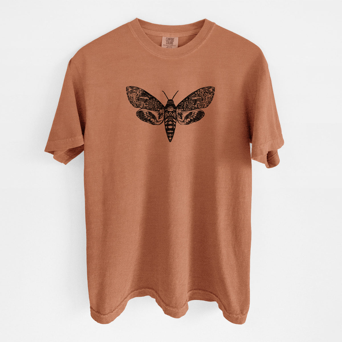 Yam burnt orange Comfort Colors t-shirt laid flat, printed with a detailed black ink illustration of a death's-head hawkmoth with its wings spread.