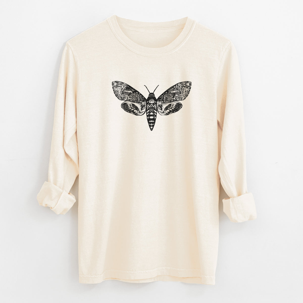 Ivory Comfort Colors long sleeve shirt laid flat with the cuffs rolled, printed with a detailed black ink illustration of a death's-head hawkmoth with its wings spread.