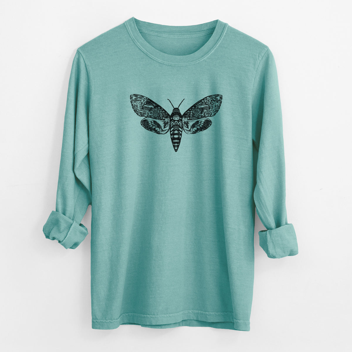 Reef green Comfort Colors long sleeve shirt laid flat with the cuffs rolled, printed with a detailed black ink illustration of a death's-head hawkmoth with its wings spread.