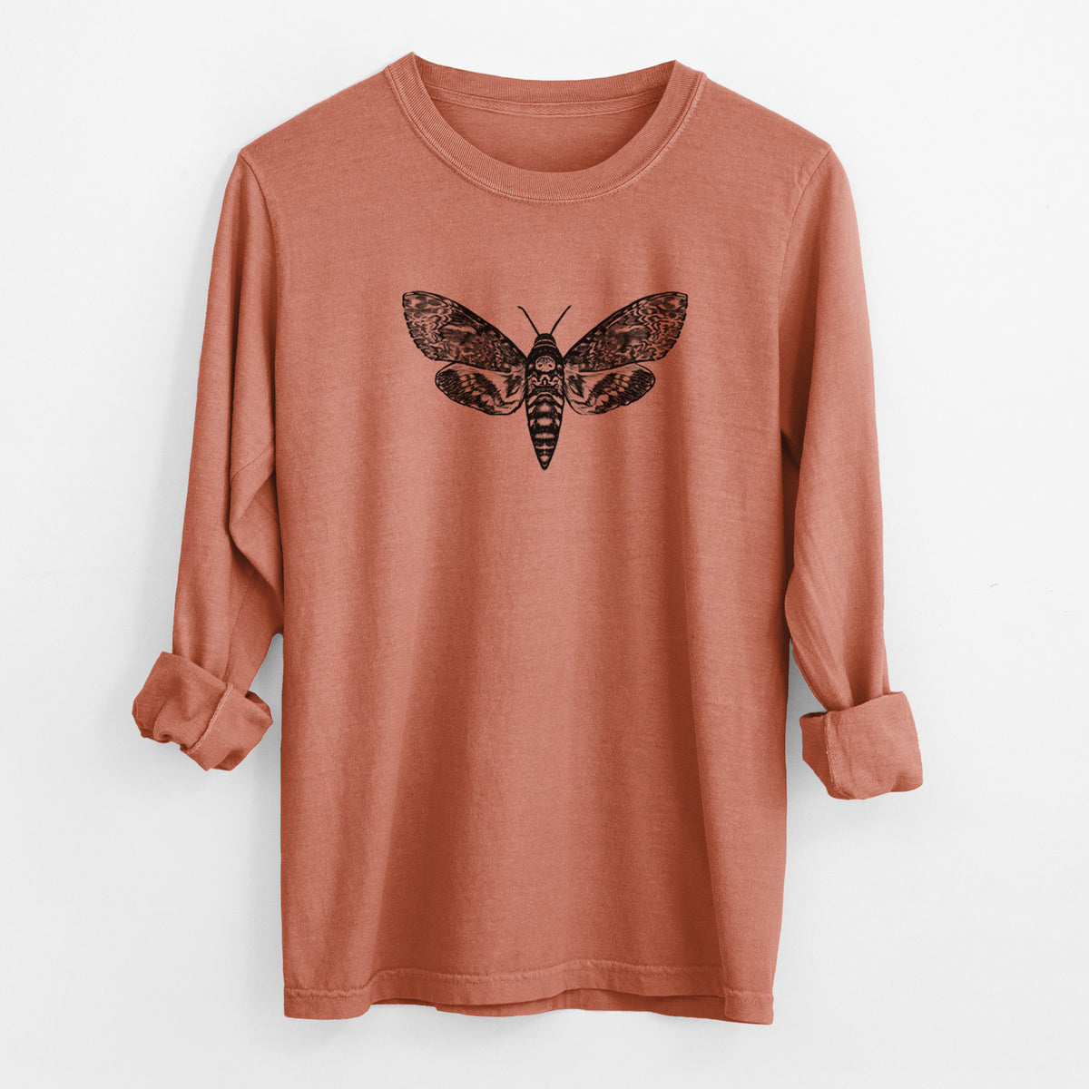 Yam burnt orange Comfort Colors long sleeve shirt laid flat with the cuffs rolled, printed with a detailed black ink illustration of a death's-head hawkmoth with its wings spread.
