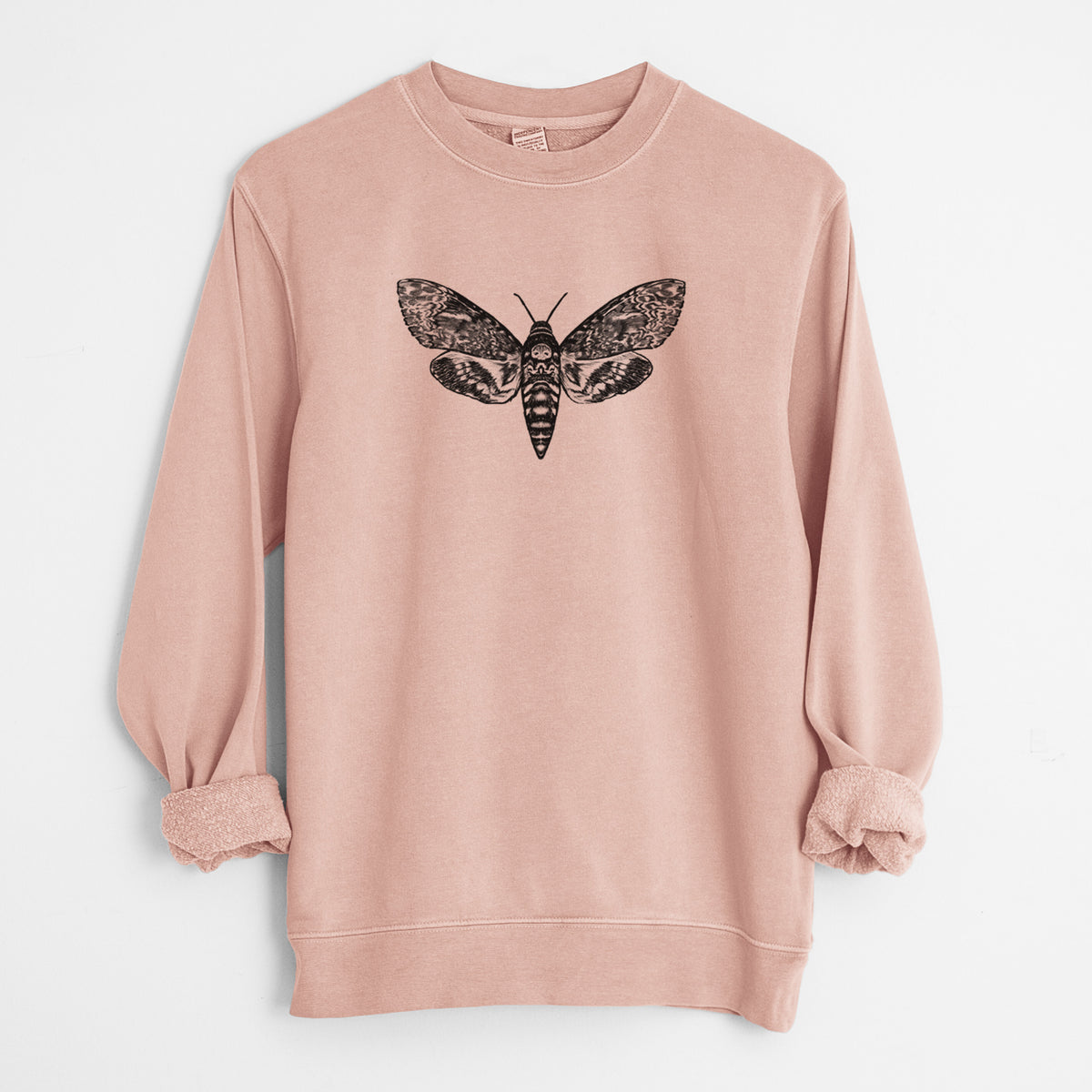 Dusty pink pigment dyed crewneck sweatshirt laid flat with the sleeves rolled, printed with a detailed black ink illustration of a death's-head hawkmoth with its wings spread.