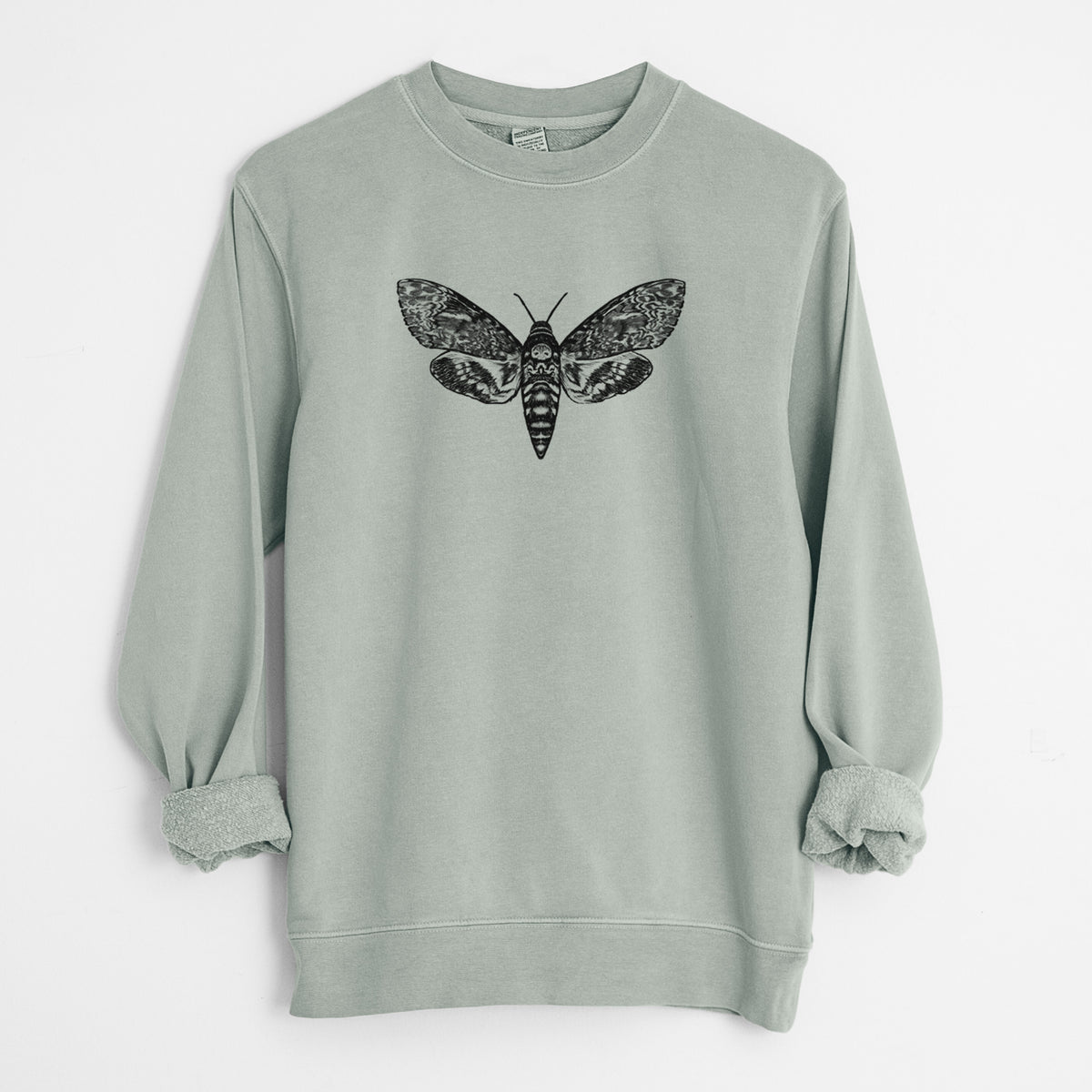 Sage green pigment dyed crewneck sweatshirt laid flat with the sleeves rolled, printed with a detailed black ink illustration of a death's-head hawkmoth with its wings spread.