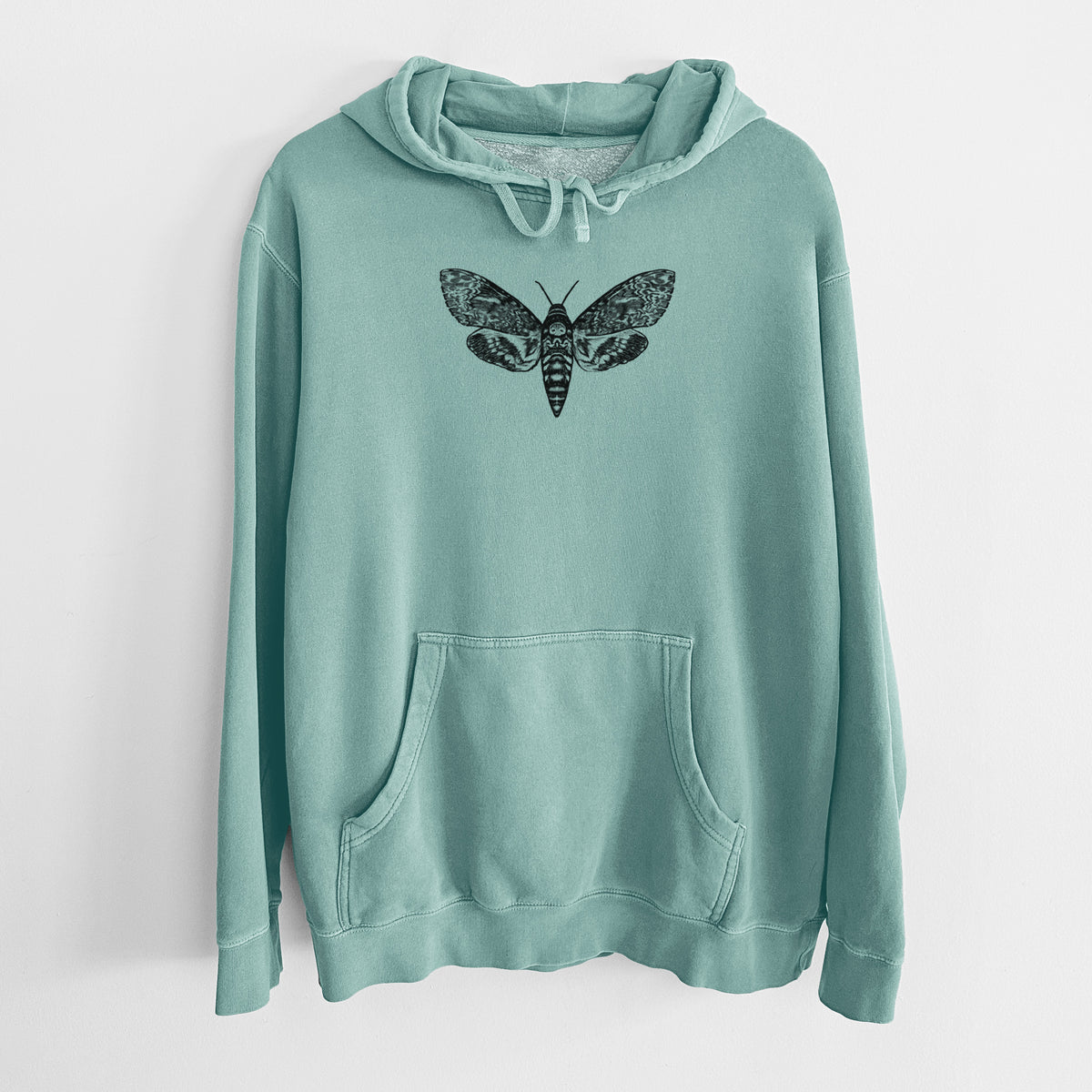 Mint green pigment dyed hoodie laid flat, printed with a detailed black ink illustration of a death's-head hawkmoth with its wings spread.