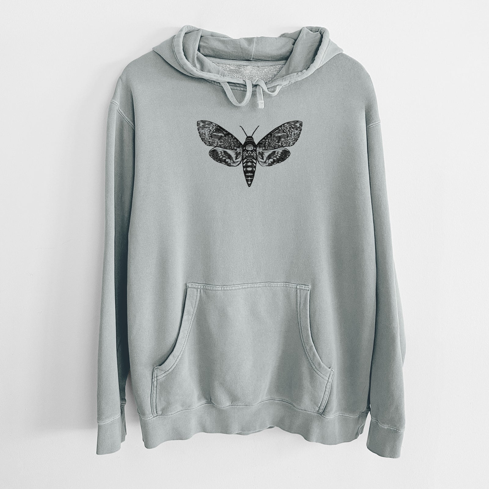 Sage green pigment dyed hoodie laid flat, printed with a detailed black ink illustration of a death's-head hawkmoth with its wings spread.