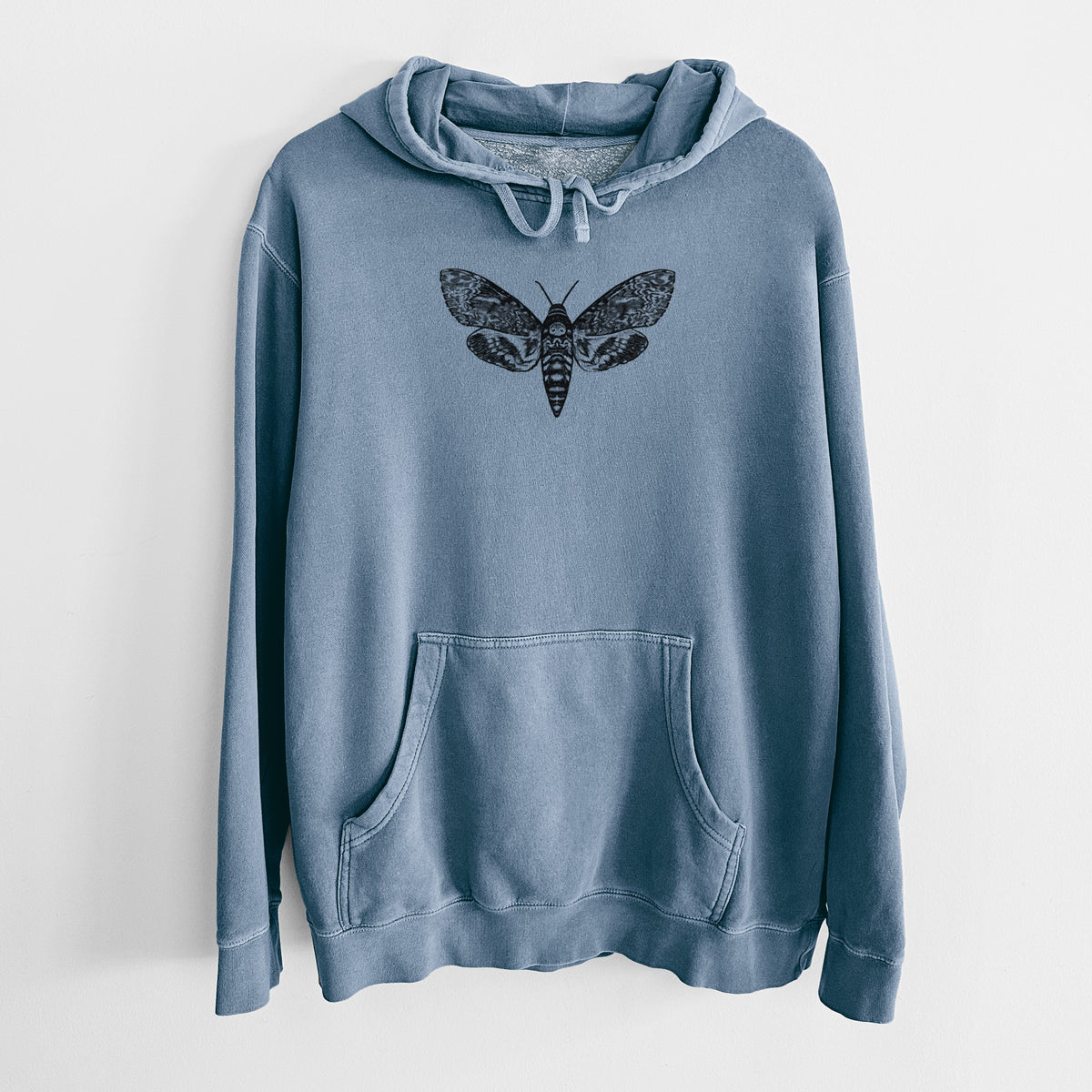 Slate blue pigment dyed hoodie laid flat, printed with a detailed black ink illustration of a death's-head hawkmoth with its wings spread.